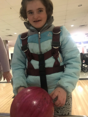 holding a bowling ball