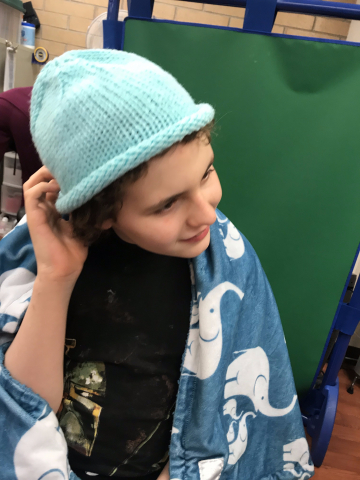 child wearing blue hat 