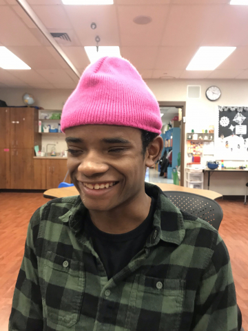 child wearing pink hat 