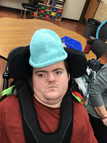 child wearing blue hat 