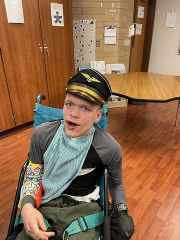 boy wearing pilots hat